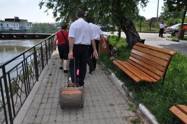 Ship doctor carrying my luggage.