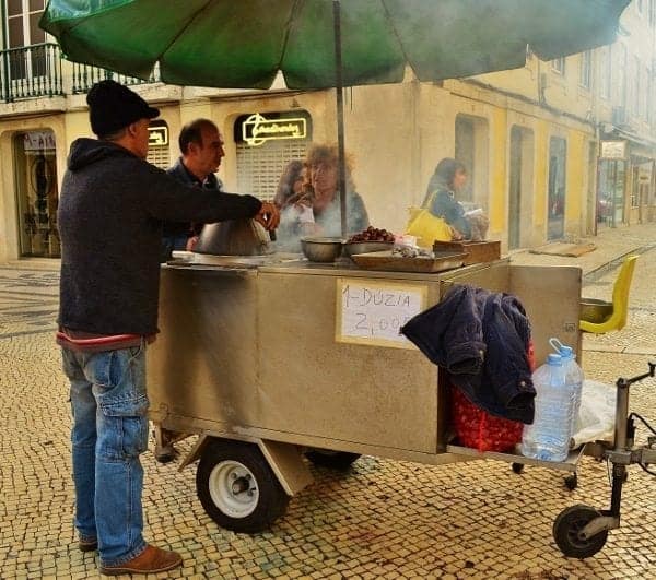 Vendors selling roasted chestnuts. 