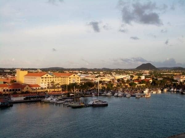 Approaching the colorful port in Aruba at dawn.