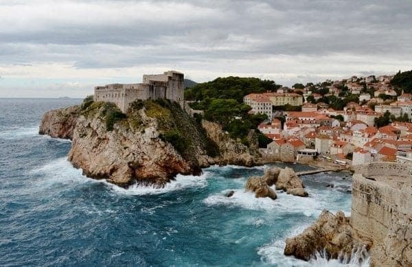 Waves crash against the rocks in the old city of Dubrovnik.