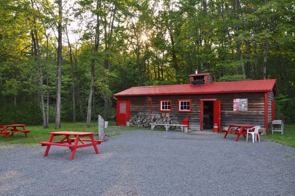 Gathering area outside of Chez Dany where guests can create their own maple sugar on a stick.