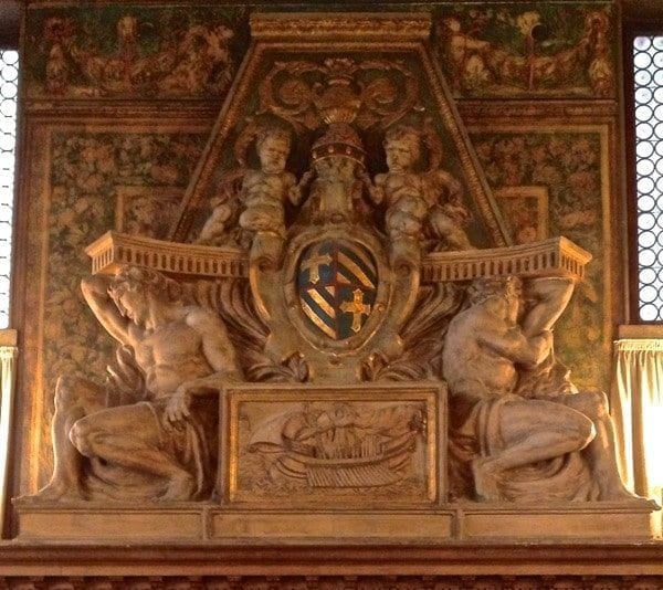Intricately carved fireplace mantle. From the main entrance turn left into the Tea Salon. 