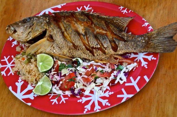Deep-fried fish, rice and cole slaw. Wonderfully tart local limes, too.