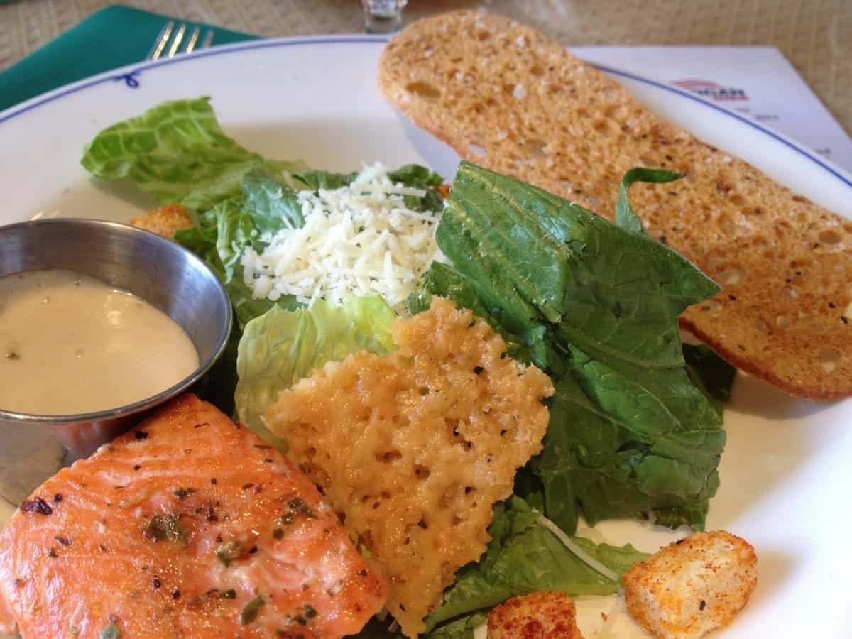 American Cruise Lines American Queen salmon dinner with parmesan crisps.
