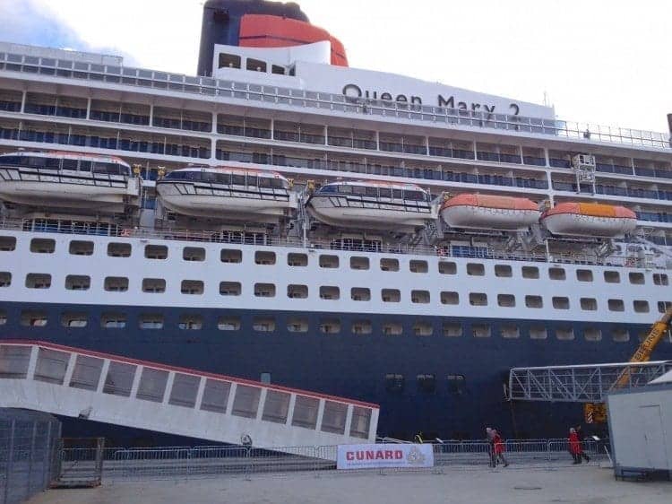 Passengers board the Queen Mary 2 in Hamburg. Nice that they dressed to match the ship's colors.