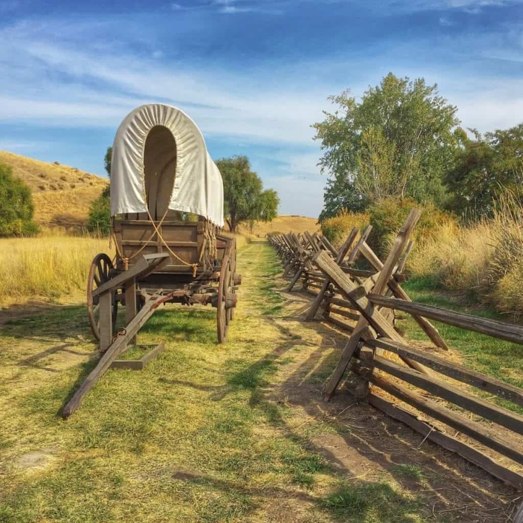 Reconstructed covered wagon sits on the actual wagon ruts of the Oregon Trail.