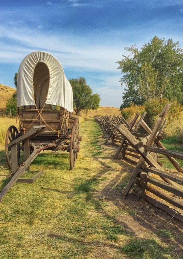 Reconstructed covered wagon sits on the actual wagon ruts of the Oregon Trail.