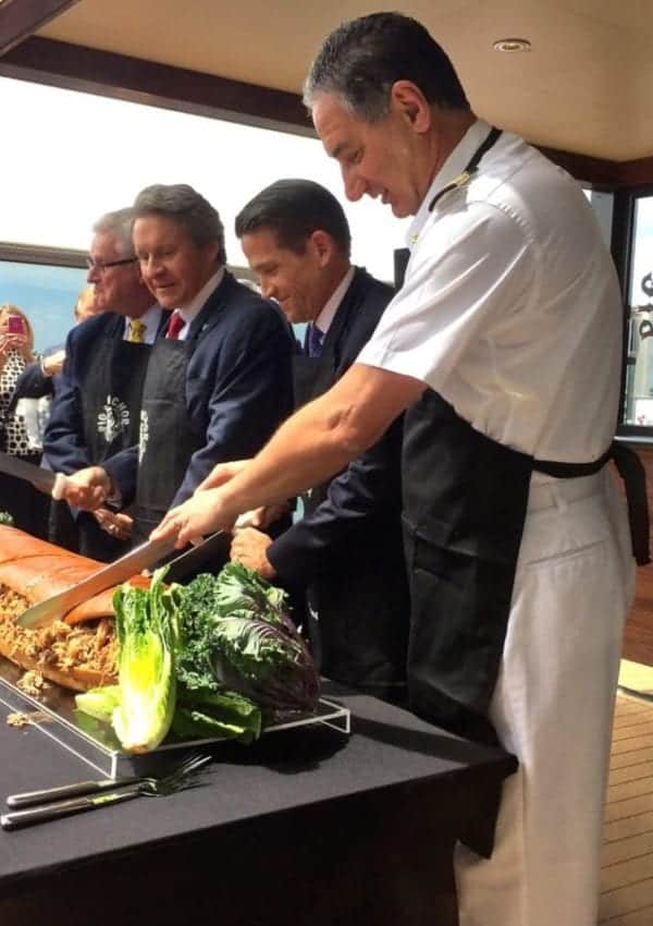 Carnival Magic Captain Anthony Marchetti leads the 6-foot long pulled pork sandwich-cutting ceremony!