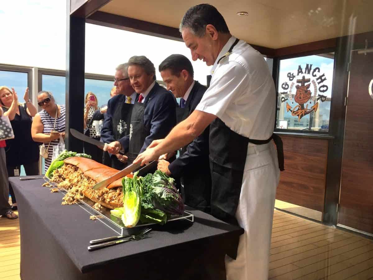 Carnival Magic Captain Anthony Marchetti leads the 6-foot long pulled pork sandwich-cutting ceremony! 
