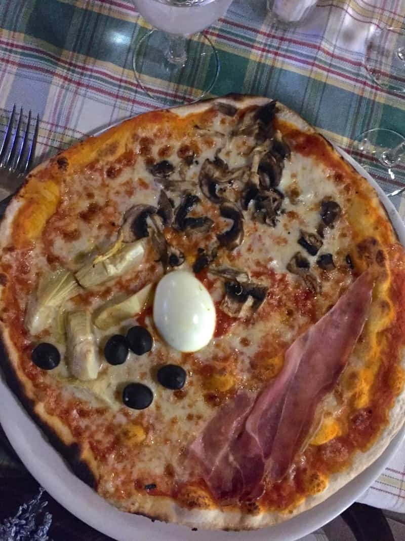 Traveling in Italy means tasting at least one pizza with an egg on top.