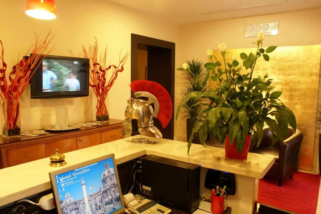 Reception desk at Hotel Versailles and that strange little Roman helmet statue. 