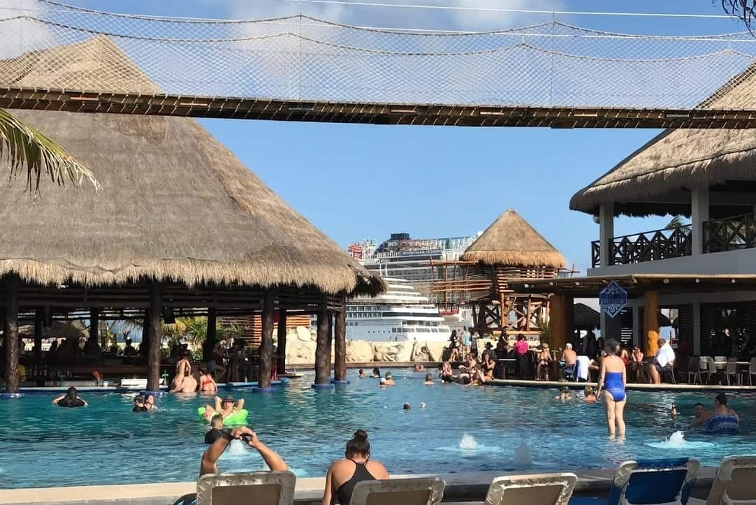 Busy and crowded swimming pool at entertainment complex in Costa Maya.