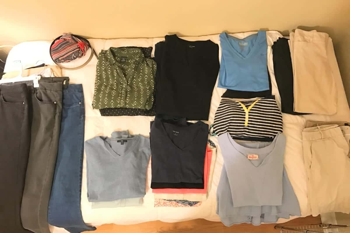Clothes set out to pack for a Norwegian Cruise line cruise.