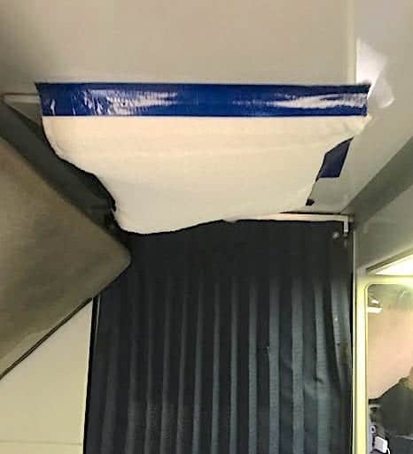 Amtrak overnight train deluxe bedroom with towel duct-taped to cover a broken air vent. 