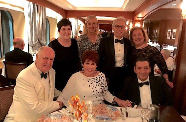 People in formal wear in Crystal Cruise main dining room.