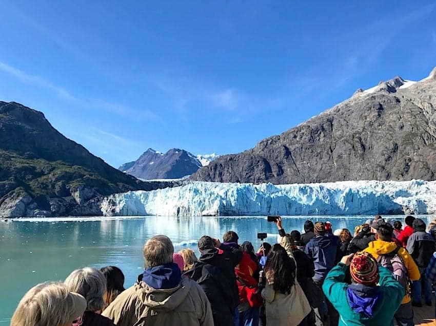People standing on the bow of the Eurodam in Glacier Bay