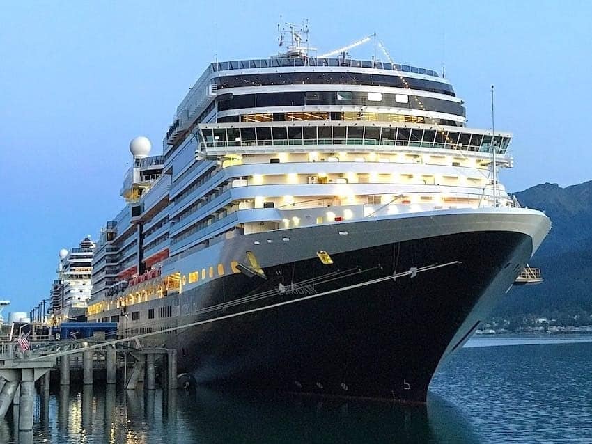 Holland America ship docked in Juneau at dusk.