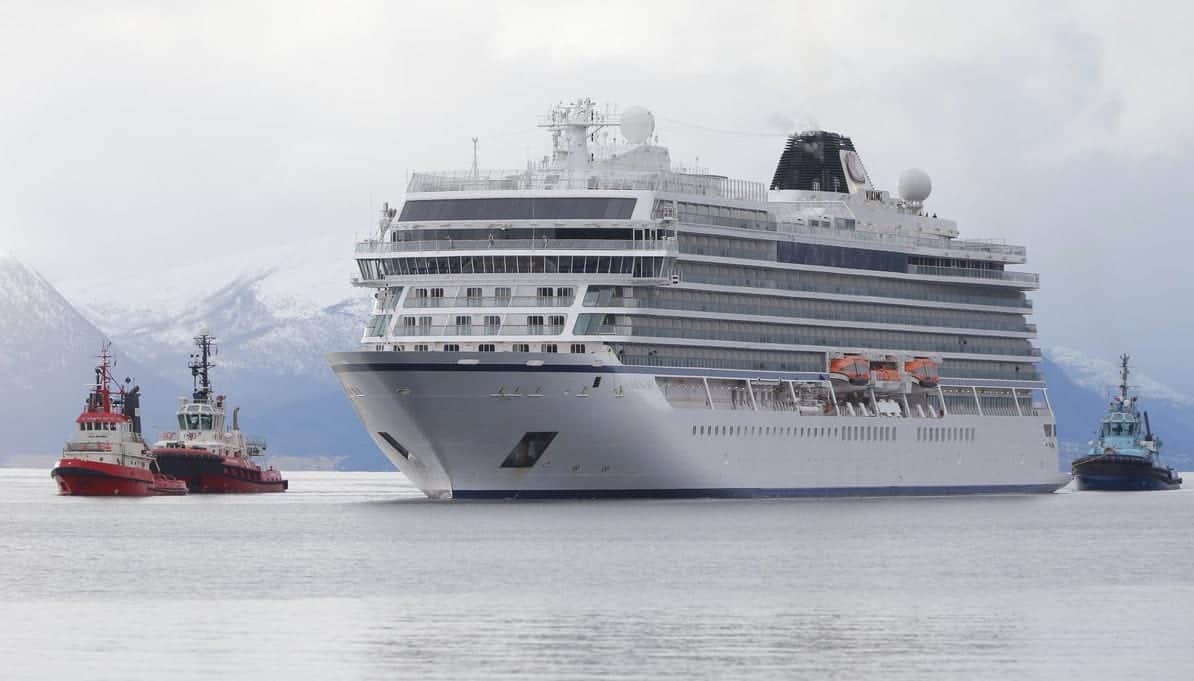 Viking Sky and tugboats arrive in Molde, Norway