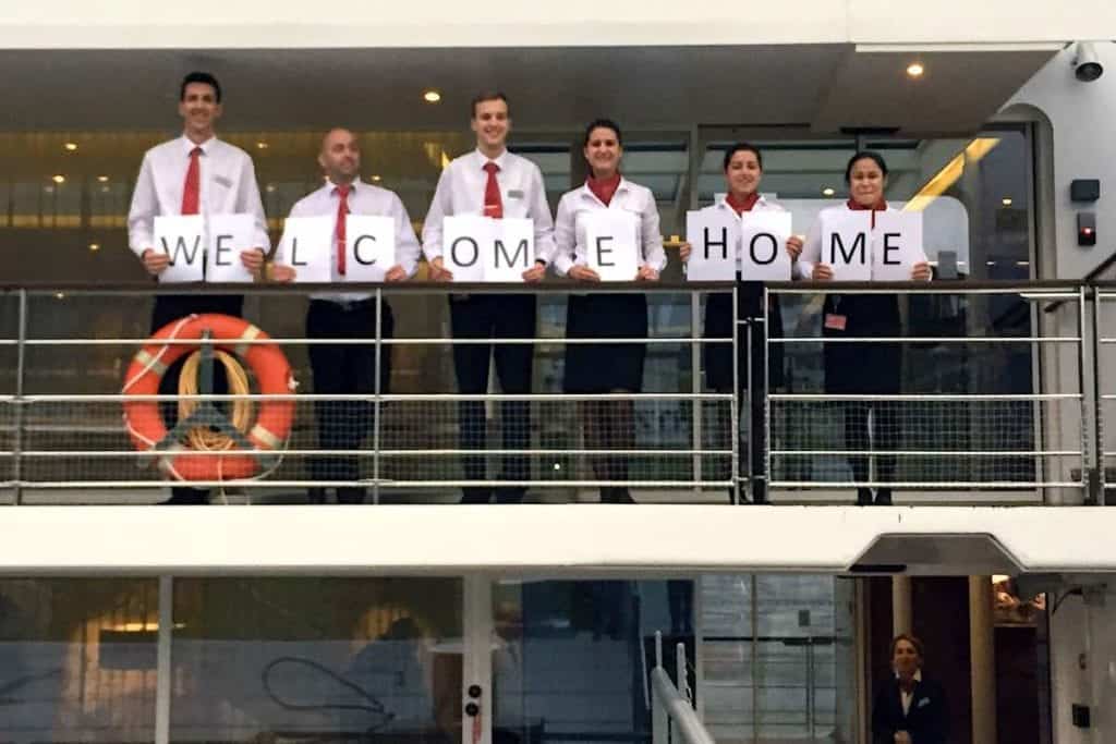 Welcome sign held by Viking Lif crew members.