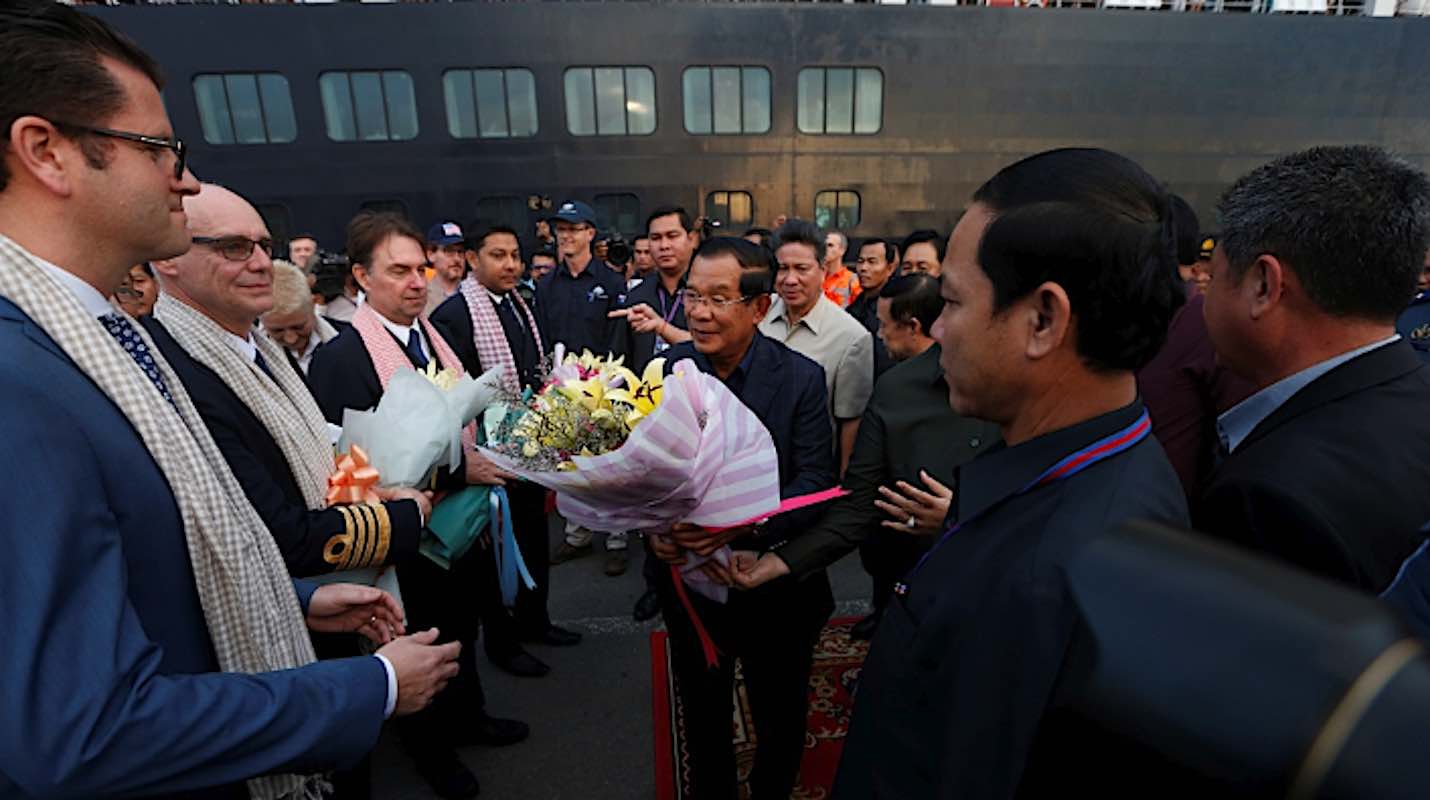 Westerdam officers are greeted with flowers as they disembark in Sihanoukville, Cambodia.