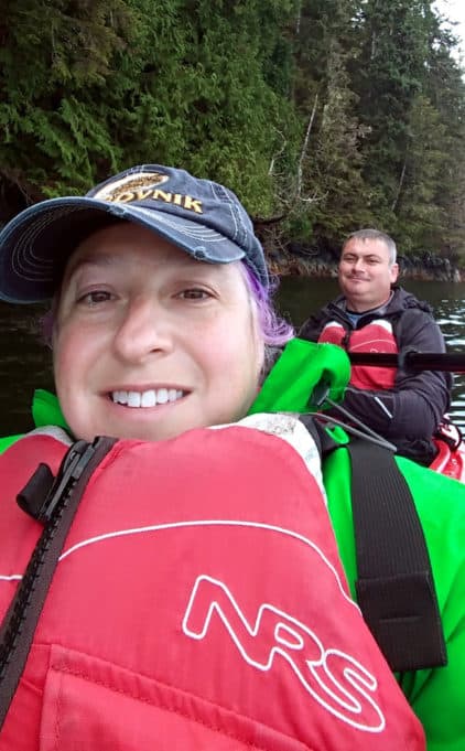 Author and husband paddling in their sea kayak 