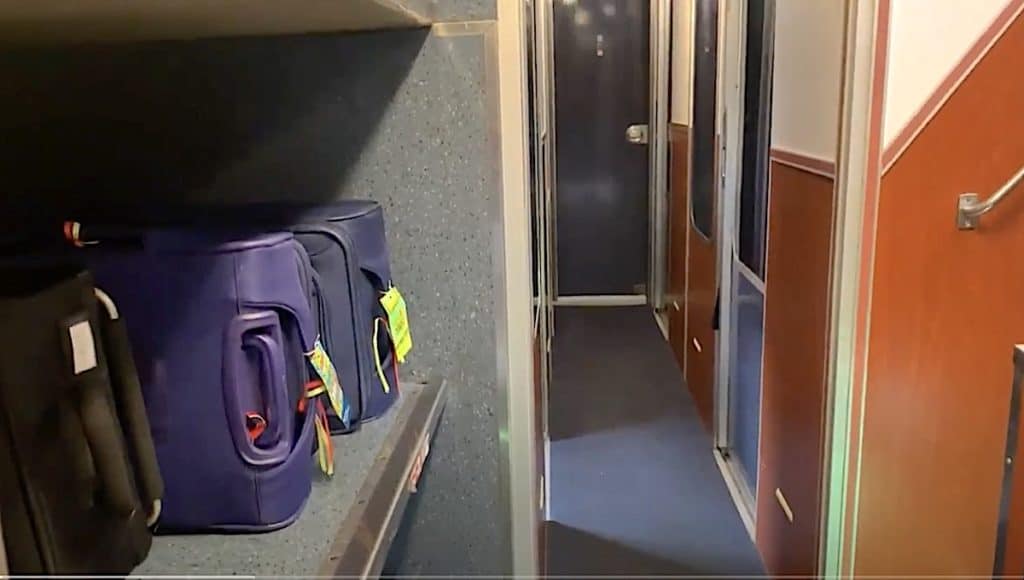 Amtrak luggage storage rack in the train car.