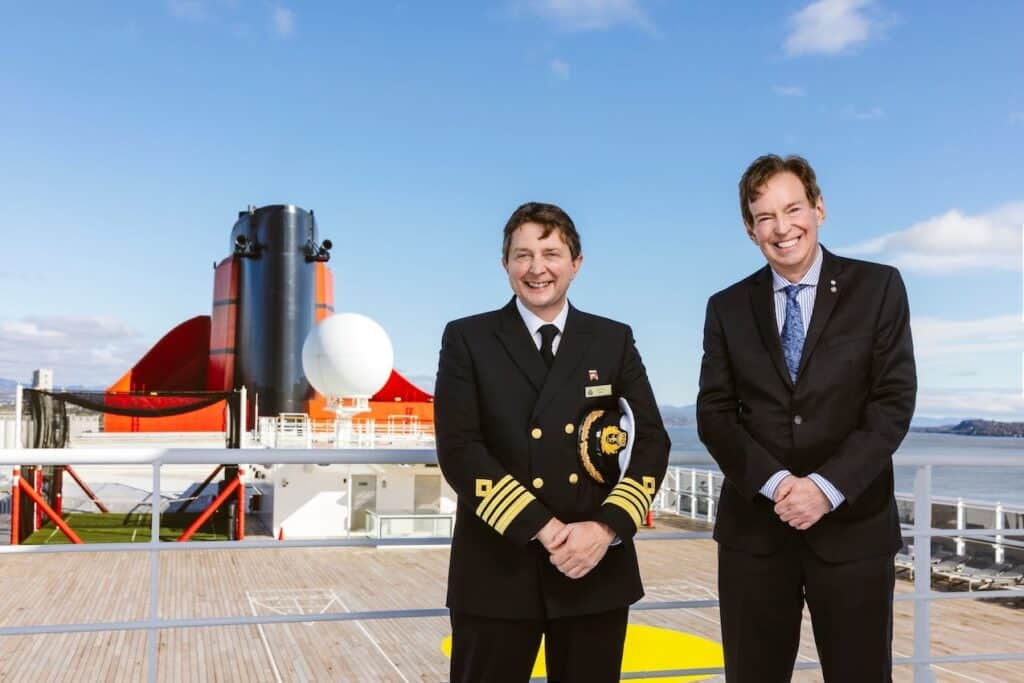 Captain Andrew Hall, Master of Cunard flagship Queen Mary 2, and RCGS CEO John Geiger.