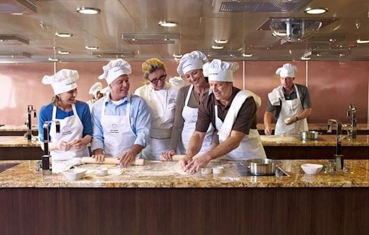 Oceania Cruises Culinary Center class with guests cooking.