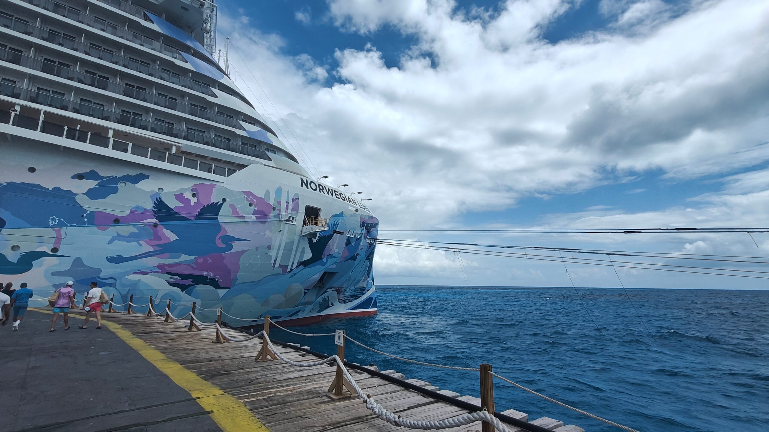 Norwegian Luna's bright hull shines on the water in the Caribbean
